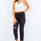 Stylish woman models High Waist Distressed Cropped Straight Jeans in black with edgy ripped details and a high waist for a trendy look.