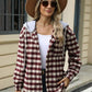 Woman wearing Bella Road Drawstring Plaid Long Sleeve Hooded Jacket, white top, and hat outdoors. Stylish fall fashion.