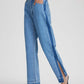 Woman wearing Bella Road Slit Straight Leg Jeans with Pockets, featuring stylish side slit and slightly stretchy denim.