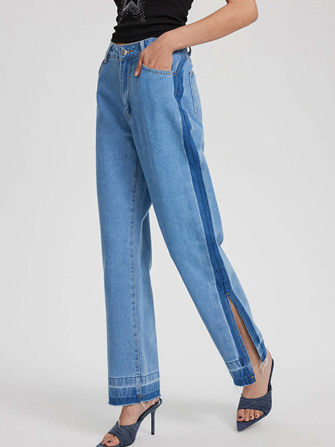 Woman wearing Bella Road Slit Straight Leg Jeans with Pockets, featuring stylish side slit and slightly stretchy denim.