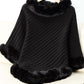 Cozy black Bella Road poncho with fuzzy trim and three-quarter sleeves for stylish warmth on chilly days.