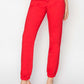 Red RISEN high waisted jogger jeans with relaxed fit and stretch fabric for a flattering silhouette and all-day comfort.