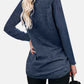 Woman wearing Bella Road round neck long sleeve t-shirt in navy blue, showing back view with pockets and slightly stretchy material.