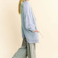 Stylish model showcasing a cozy light blue ribbed hem cardigan paired with trendy wide-leg pants. Perfect for any season!