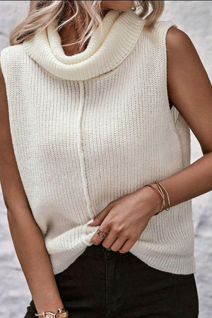 Cozy Bella Road sleeveless turtleneck sweater vest in white, featuring a central seam and stylish layered look.