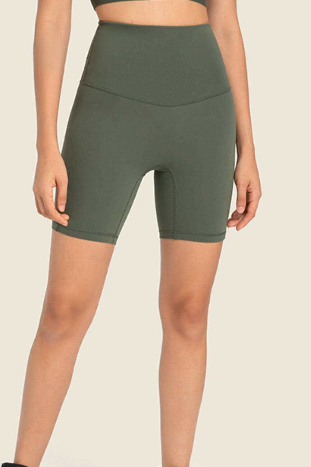 Millennia Seamless High-Rise Wide Waistband Biker Shorts in olive green, perfect for comfort and style during workouts or lounging.