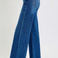 High rise wide leg jeans with raw hem, showcasing flattering silhouette and pocket detail. Perfect for chic fashion-forward styles.