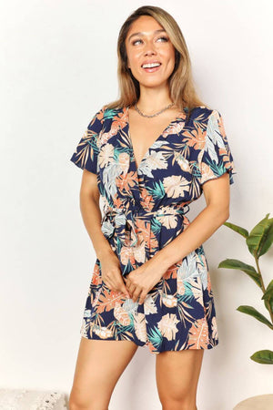 DOUBLE TAKE Botanical Print Surplice Neck Tie Waist Romper at Bella Road