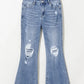 Distressed raw hem bootcut jeans with slight stretch and ripped details, perfect for casual wear. Machine washable.