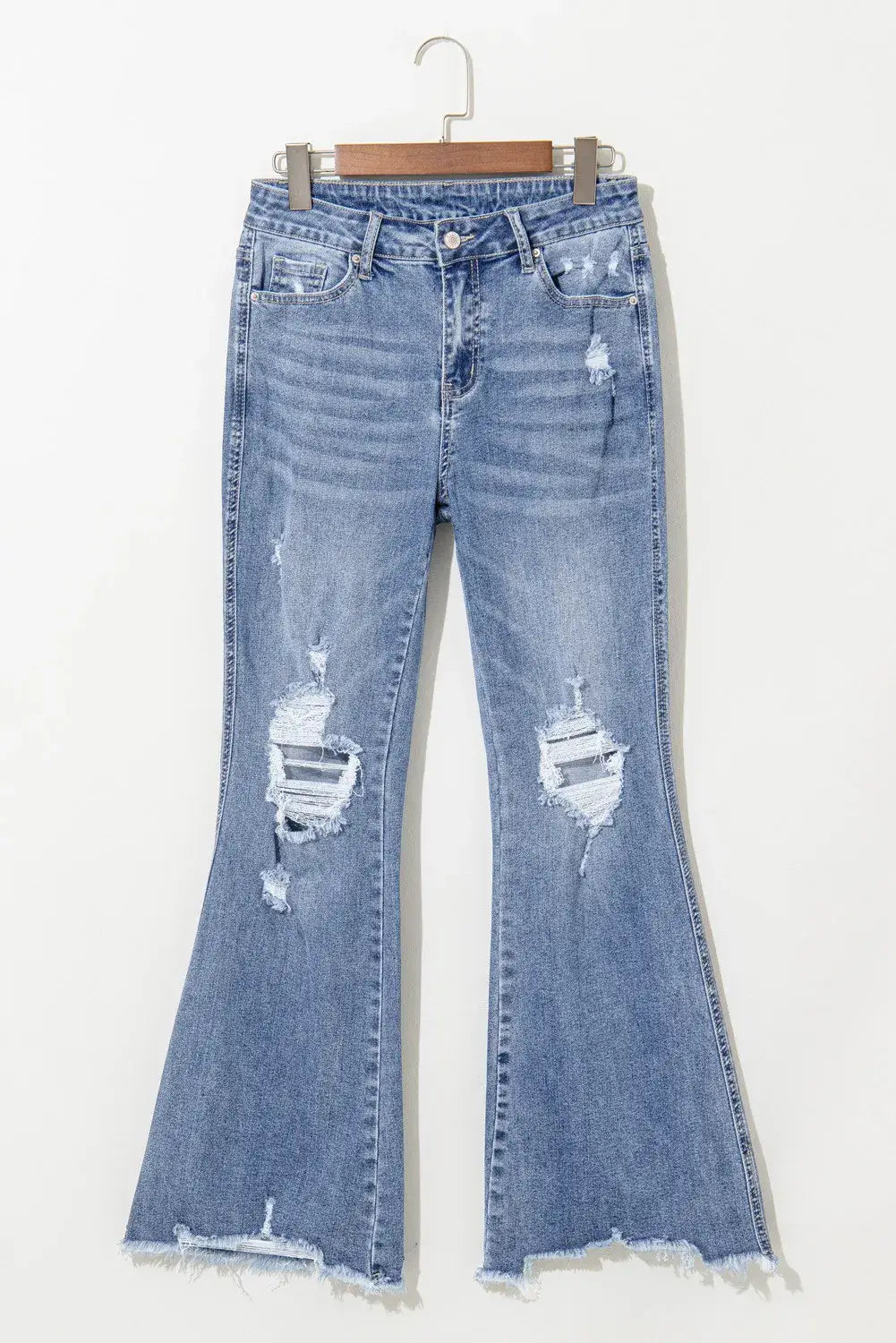 Distressed raw hem bootcut jeans with slight stretch and ripped details, perfect for casual wear. Machine washable.