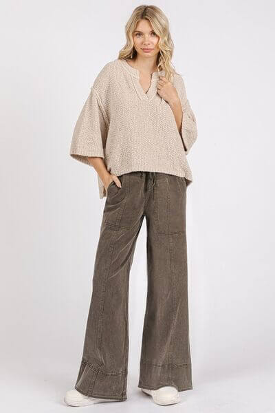 Stylish model in cozy beige top and mineral wash elastic wide leg pants, perfect for a relaxed casual outfit.