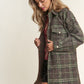 Woman wearing J.NNA snap-down tweed plaid longline shacket, perfect for fall layering with cozy style and comfort.