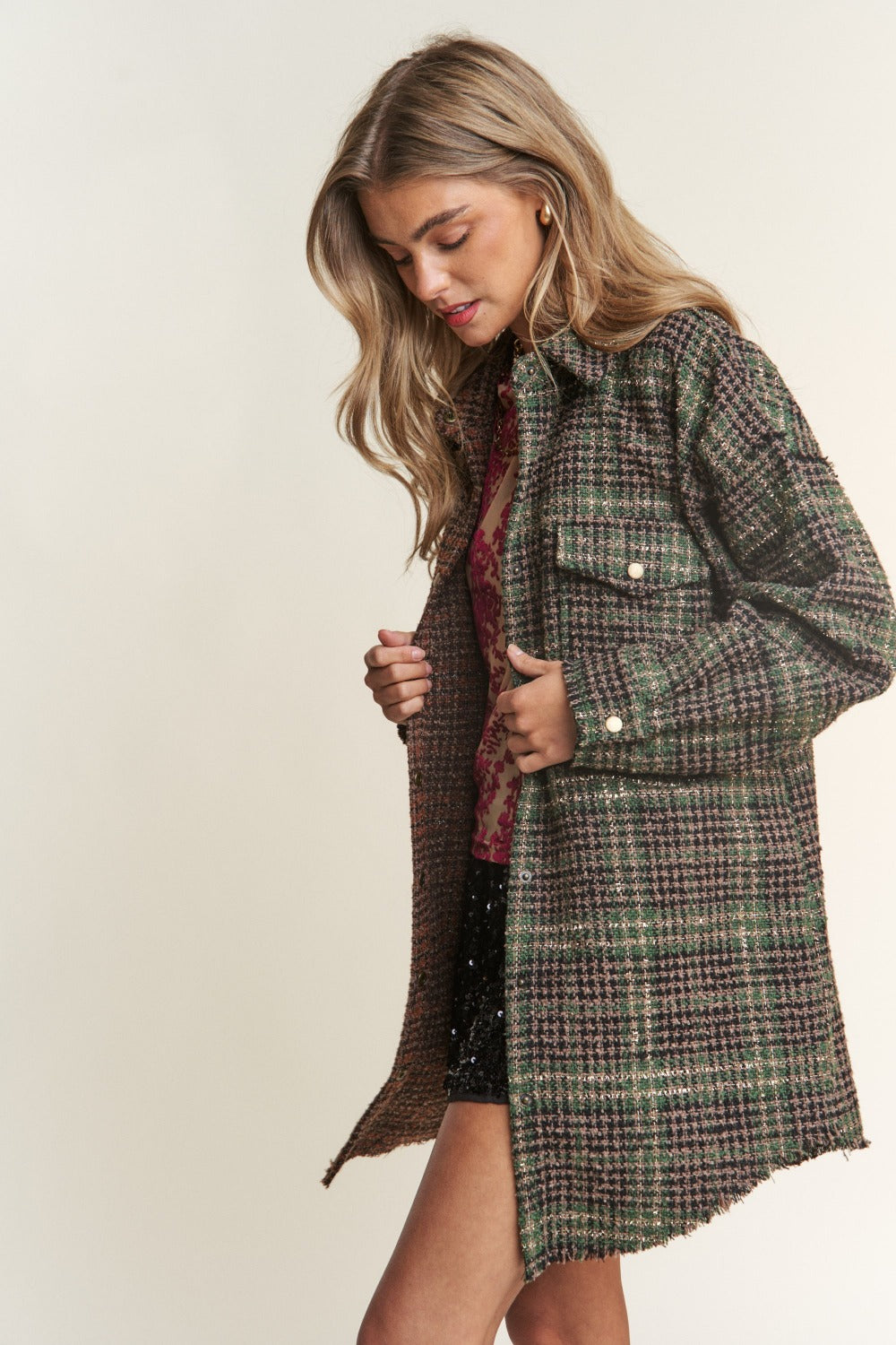 Woman wearing J.NNA snap-down tweed plaid longline shacket, perfect for fall layering with cozy style and comfort.