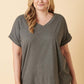 Woman wearing a gray V-Neck Rolled Short Sleeve T-Shirt, perfect for casual style and comfort.