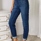 Skinny cropped Judy Blue jeans, styled with a white top and heels, showcasing trendy and stylish fit suitable for versatile outfits