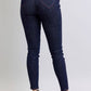 Heart-shaped back pocket skinny jeans in dark wash showcasing a flattering fit and stylish vibe for versatile wear.