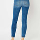 Back view of cuffed hem low waist skinny jeans by Judy Blue, featuring a flattering slim fit and modern flair