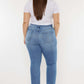 Woman wearing Cat's Whiskers High Waist Jeans with retro detailing, showcasing a flattering back view and stylish fit.