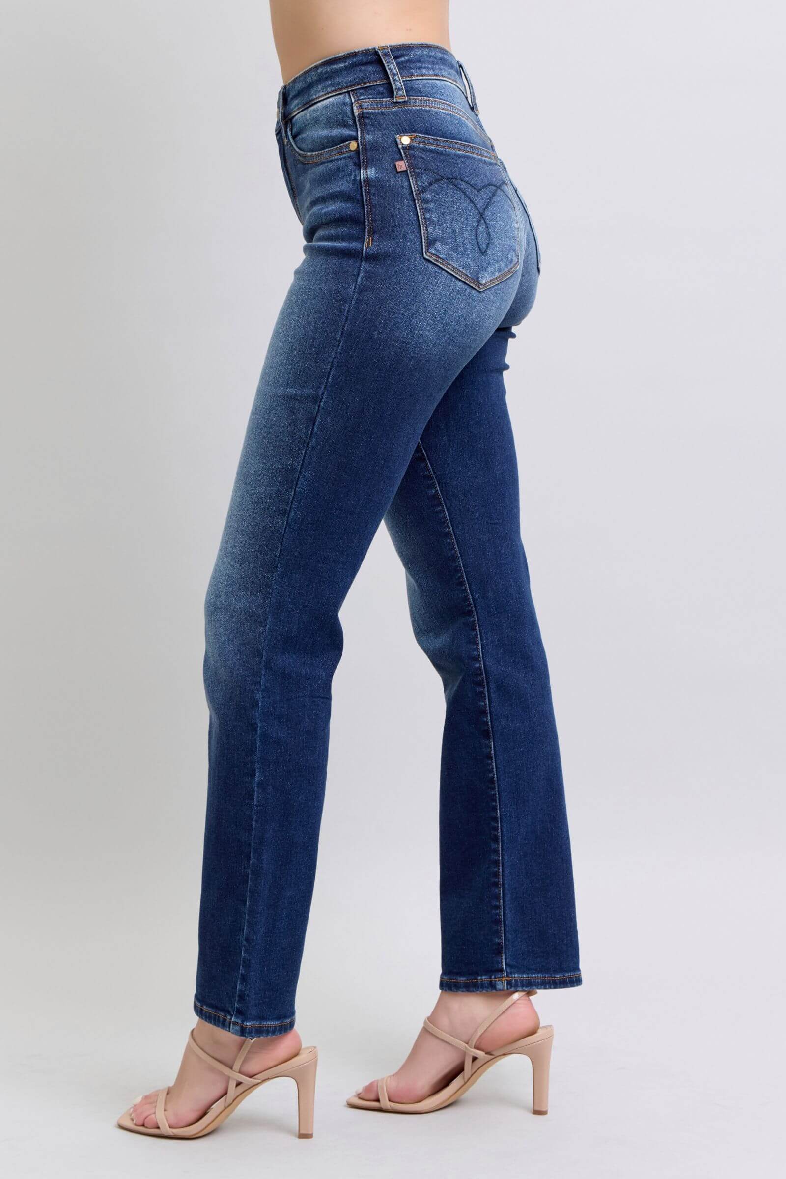 Woman wearing Judy Blue washed straight leg jeans with pockets, showcasing a stylish and flattering silhouette.