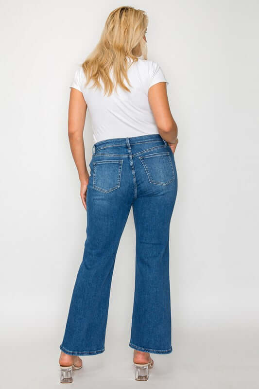 Woman showcasing the back of bytos Full Size Cat's Whiskers Mid Rise Ankle Jeans with a casual white t-shirt.