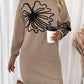 Woman wearing Perfee Flower Mock Neck Long Sleeve Sweater Dress holding a coffee cup, showcasing cozy and stylish fashion for any occasion