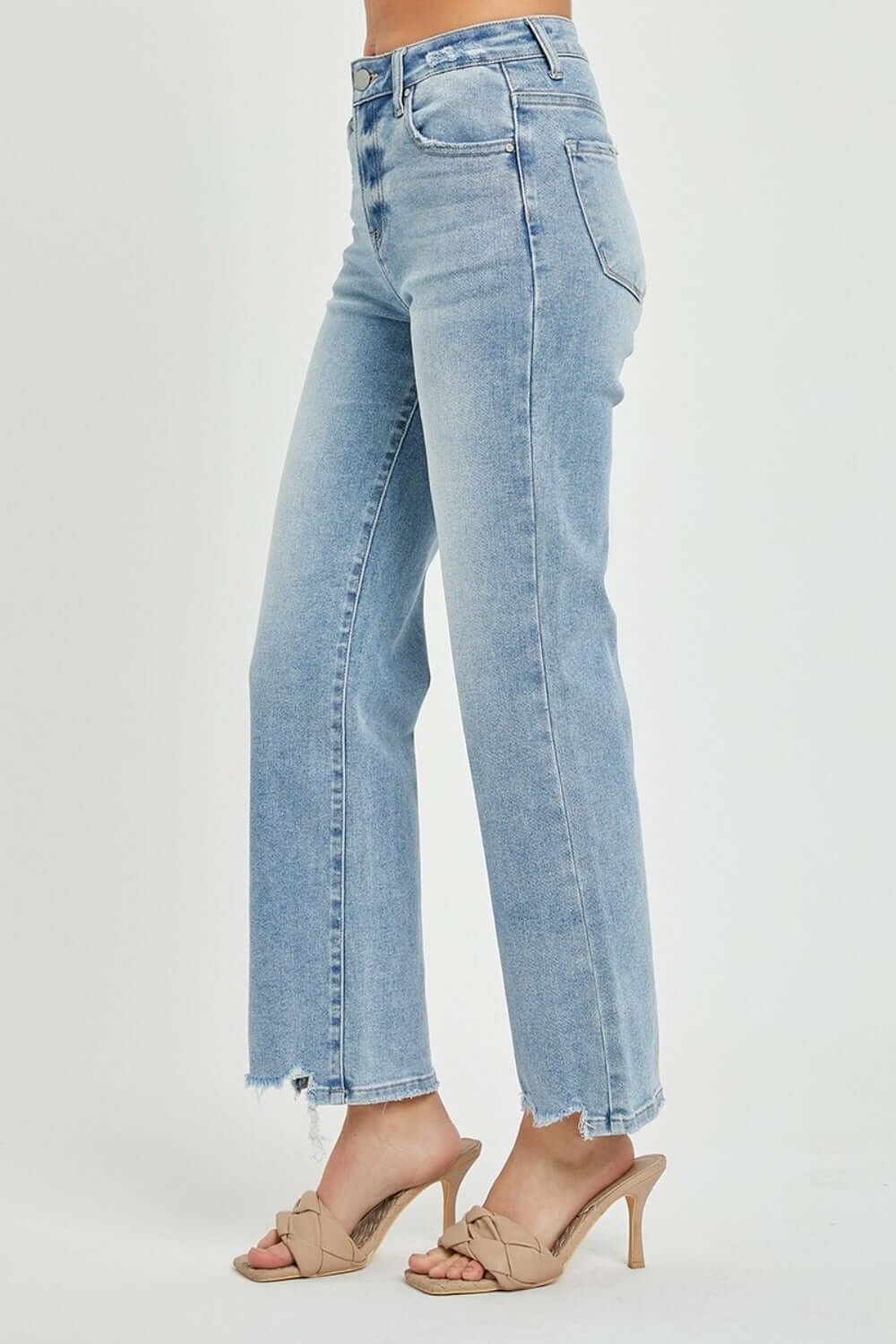 Full size high-rise straight jeans with frayed hem, worn with beige heeled sandals. Versatile and flattering classic denim look.