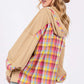 Woman wearing a full-size plaid print mineral wash hoodie with adjustable drawstring and contrast multi-plaid back, showcasing a cool, vintage style.