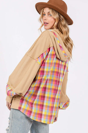 Woman wearing a full-size plaid print mineral wash hoodie with adjustable drawstring and contrast multi-plaid back, showcasing a cool, vintage style.