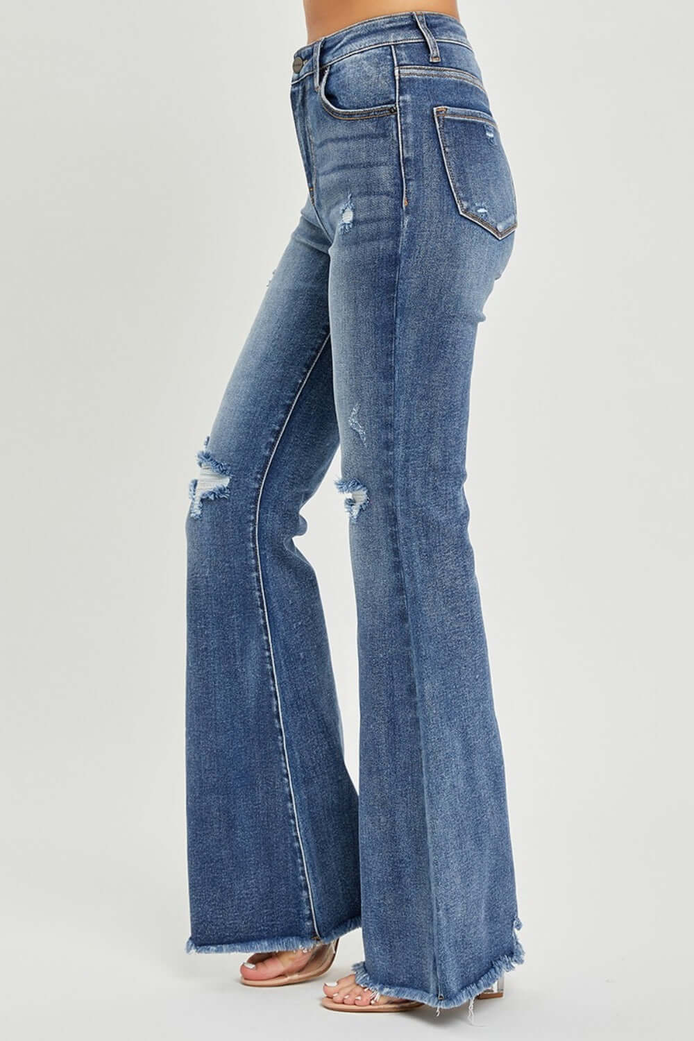 High waist distressed flare jeans by Risen Jeans with trendy urban-chic detailing and a flattering fit, perfect for retro-inspired outfits.