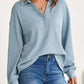 Woman wearing blue waffle-knit Johnny collar long sleeve sweatshirt with slight stretch, paired with blue jeans.