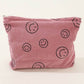 Zenana Corduroy Smile Clutch Bag in pink with smiley face print, perfect for casual or semi-formal occasions.