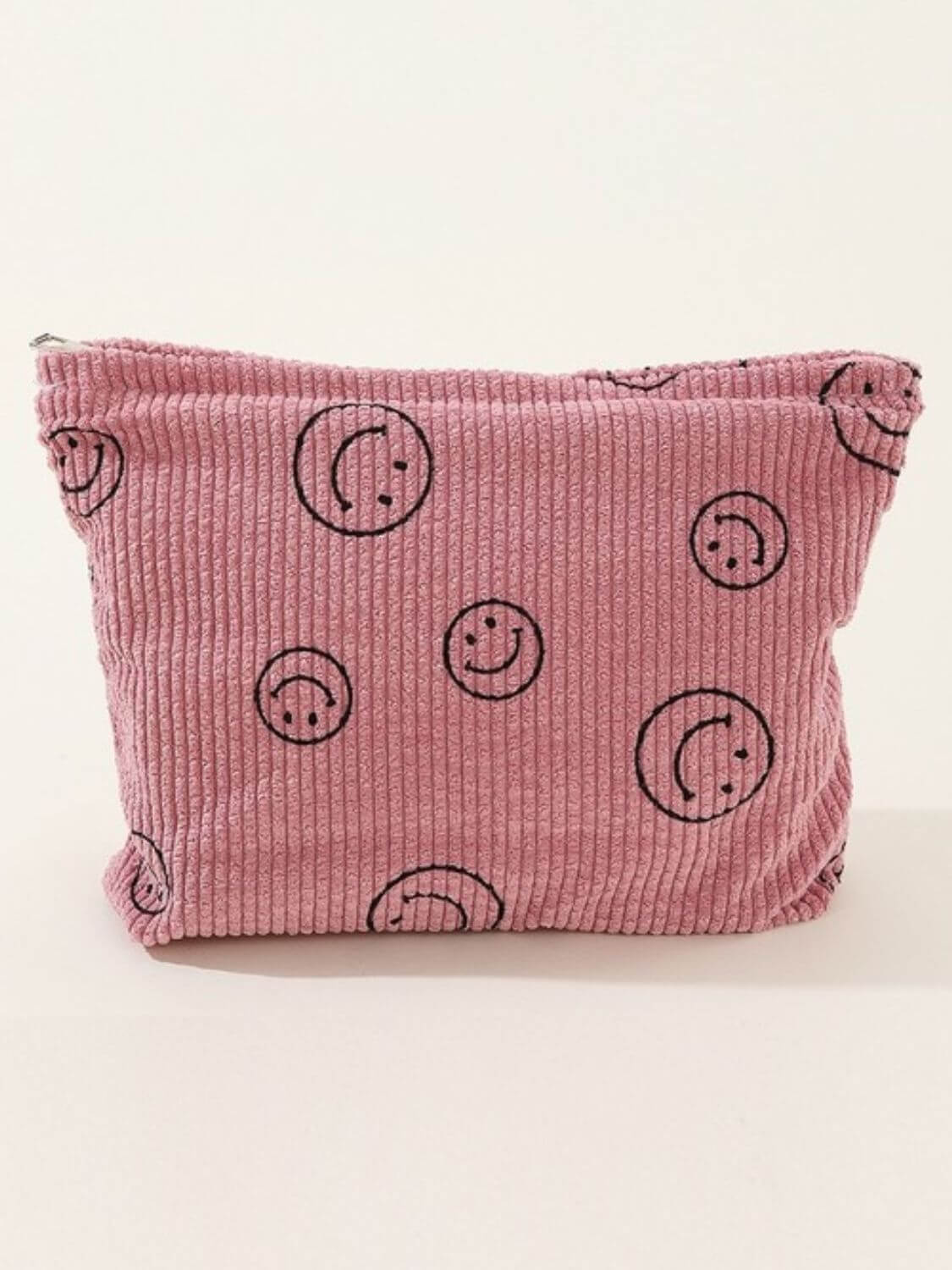 Zenana Corduroy Smile Clutch Bag in pink with smiley face print, perfect for casual or semi-formal occasions.