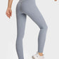 Woman in high waist, ultra soft blue leggings showcasing a comfy athleisure look paired with stylish sneakers.