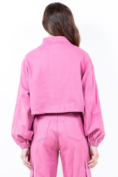 Back view of a pink cropped worker jacket with drawstring hem and balloon sleeves, paired with matching pants.