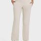 Millennia Pocketed High Waist Active Pants in cream, featuring a smooth fit and convenient side pockets for workouts.