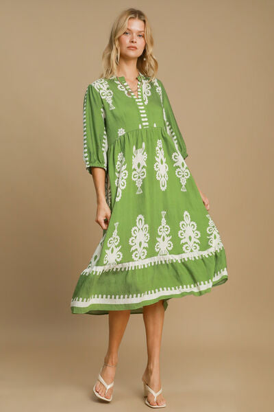 Umgee printed notched midi dress in green with white floral patterns, perfect for casual and semi-formal occasions.