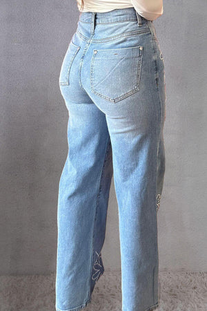 Woman wearing rhinestone straight jeans with pockets, back view. Featuring 75% cotton, 23% polyester, 2% elastane. Ready for stylish outings!