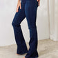 Woman wearing mid-rise flare jeans with a clean, non-distressed look, perfect for a versatile wardrobe staple.