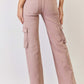 Back view of RISEN full size high-rise cargo wide leg jeans in blush pink, showing functional cargo pockets and trendy wide-leg fit.