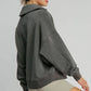 Stylish woman in a gray Johnny Collar Dropped Shoulder Sweatshirt, showcasing a relaxed fit and trendy design.