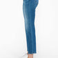 Side view of bytos Cat's Whiskers mid rise ankle jeans, highlighting the modern fit and playful style.