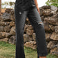 Black Bella Road Distressed Jeans with stylish pockets and a slightly stretchy fit, perfect for adding edge to any wardrobe.