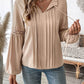 Woman wearing Perfee Frill Tie Neck Long Sleeve Blouse with lace detail, styled with blue jeans.