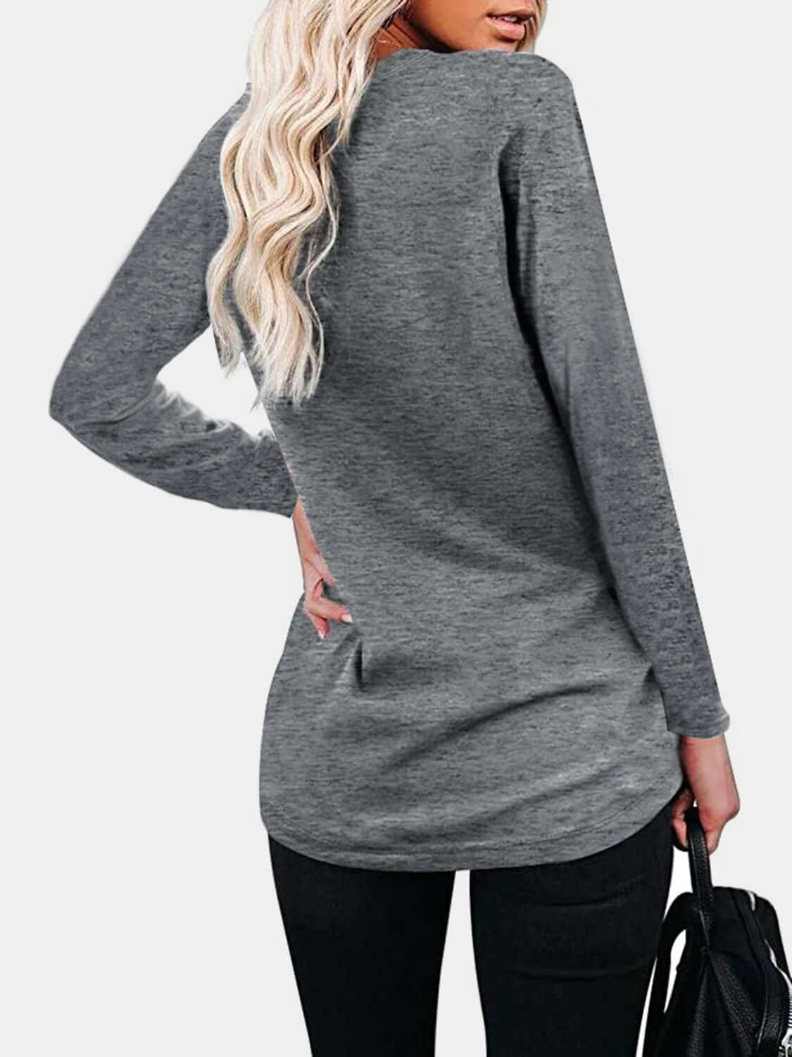 Woman wearing Bella Road Round Neck Long Sleeve T-Shirt in gray, back view showing long blonde hair and black pants.