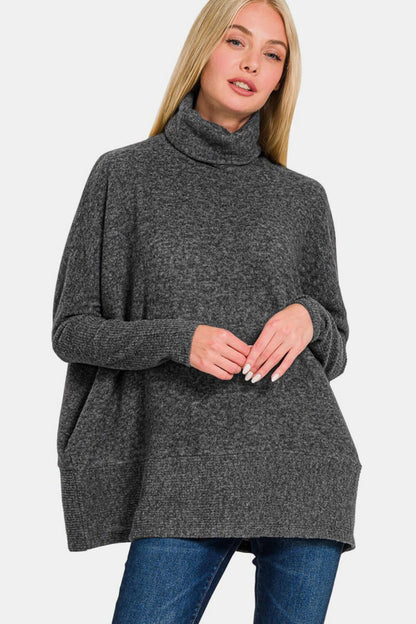 Cozy Zenana melange hacci turtleneck sweater in soft gray, perfect for layering and adding elegance to casual or dressy outfits.