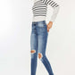 High Waist Distressed Raw Hem Ankle Skinny Jeans with playful cropped length and rebellious detailing, paired with casual striped sweater and sneakers