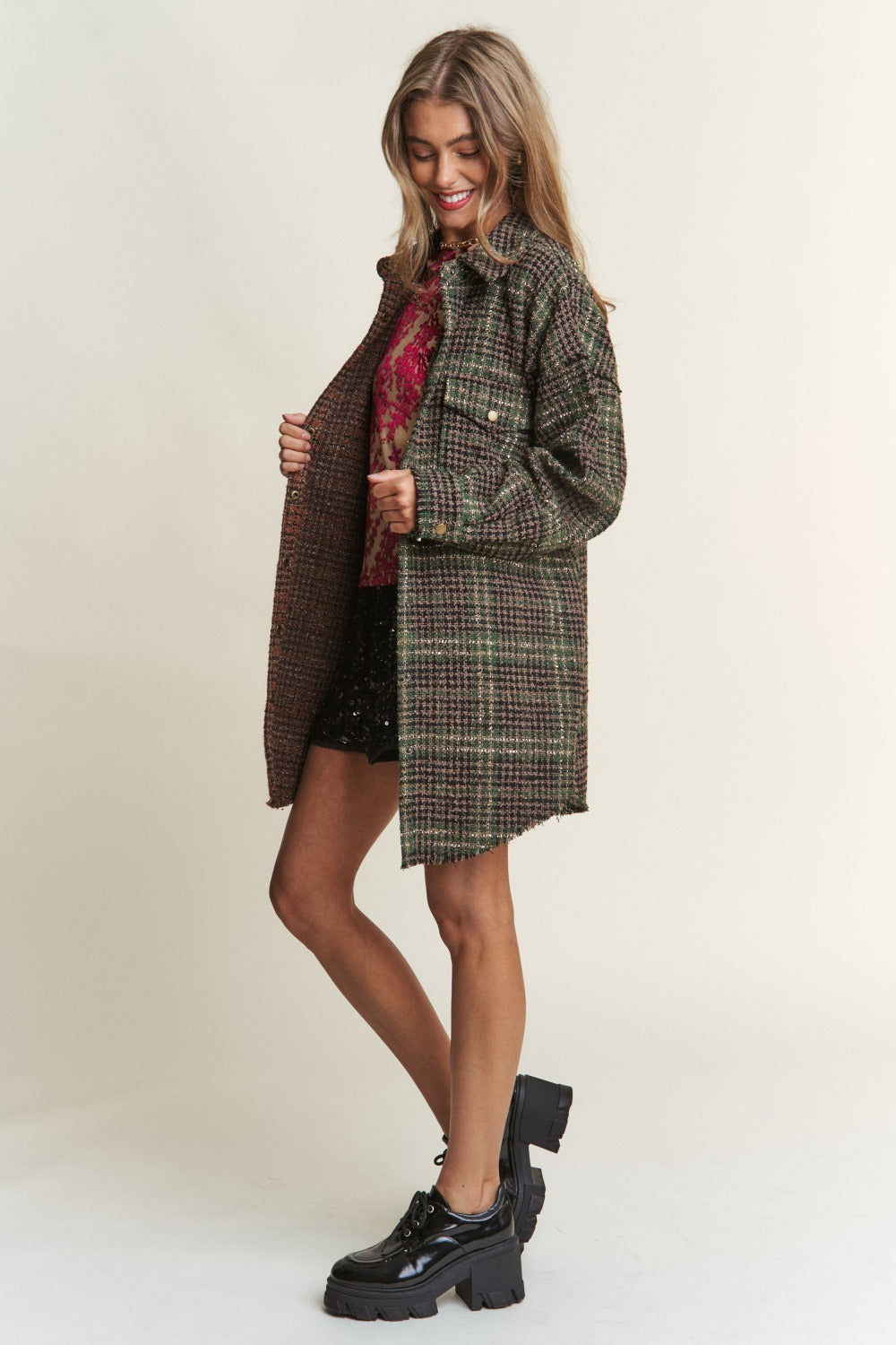 Stylish woman in J.NNA snap-down tweed plaid longline shacket, perfect for fall layering and modern comfort.