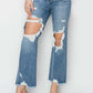 High Rise Distressed Crop Straight Jeans by Risen Jeans, showcasing edgy ripped details and stylish cropped length for a trendy look.