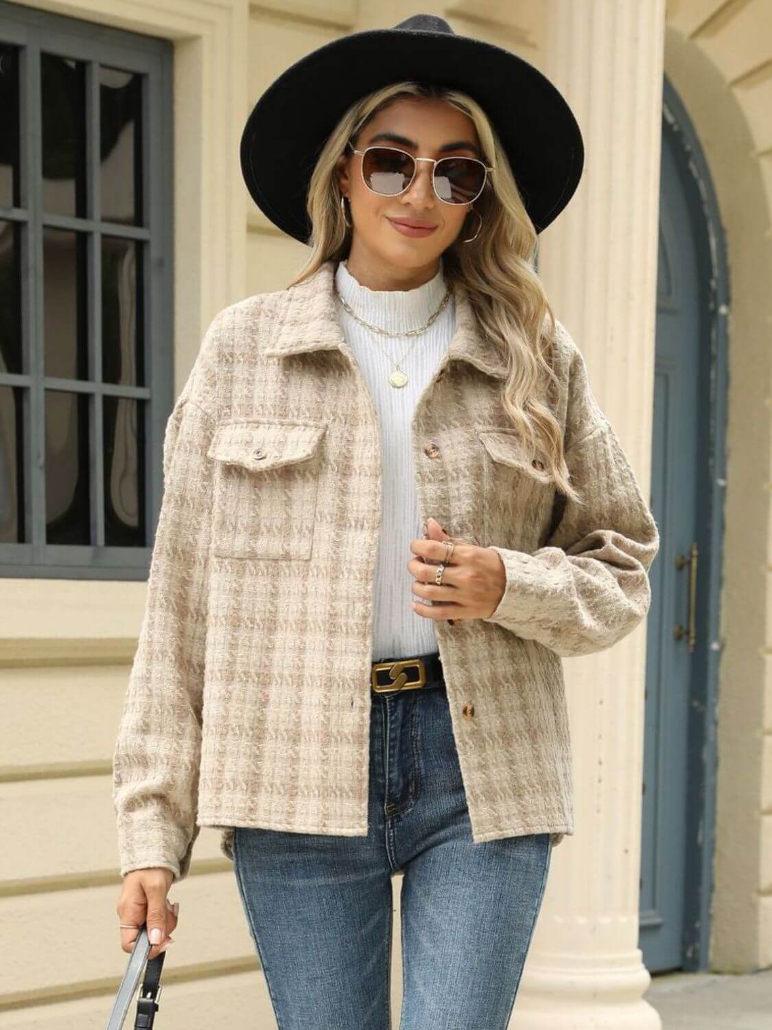 Woman wearing Bella Road Plaid Collared Neck Long Sleeve Jacket with sunglasses, hat, and jeans on the street