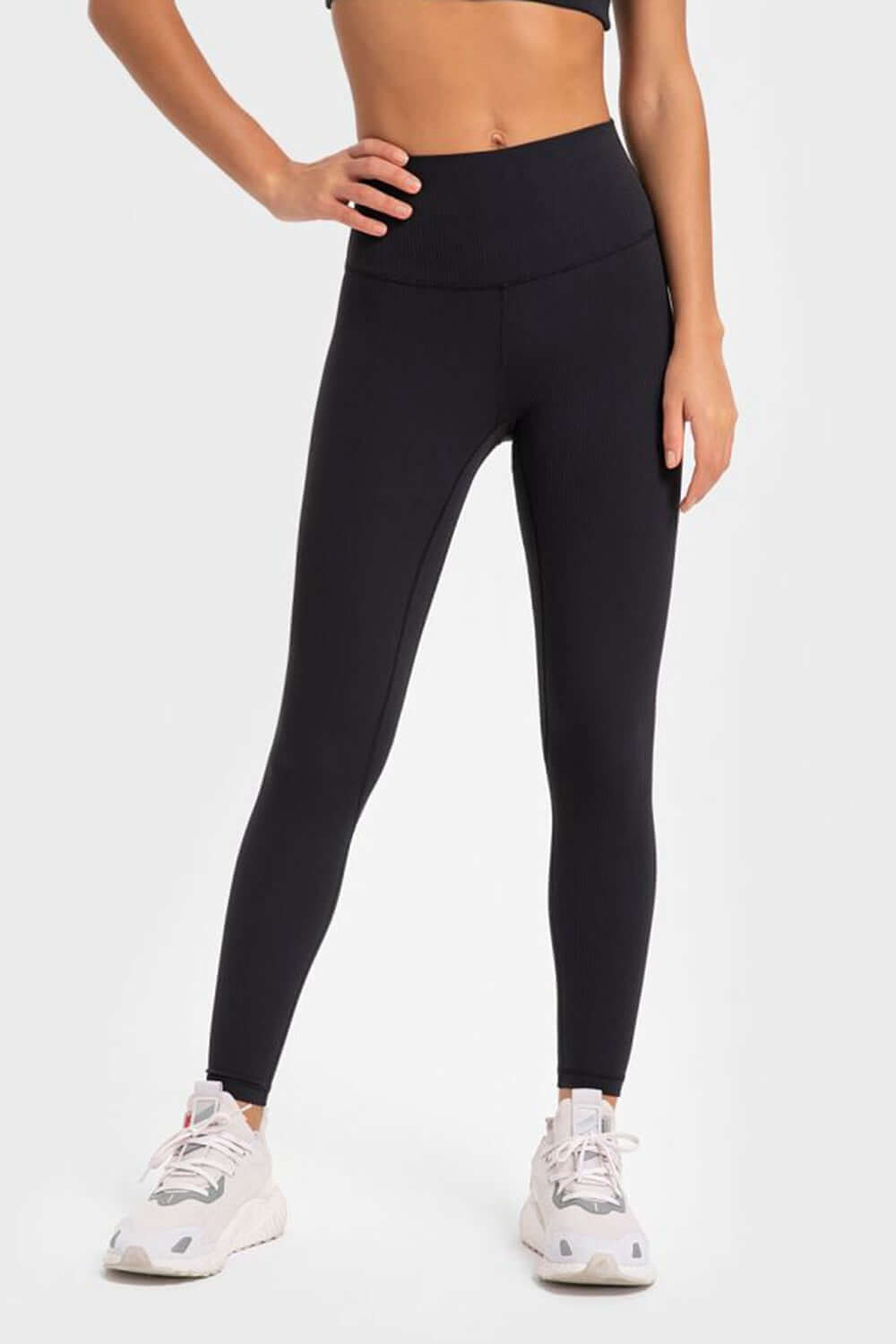 Millennia highly stretchy black yoga leggings with wide waistband, perfect for stylish comfort in workouts.